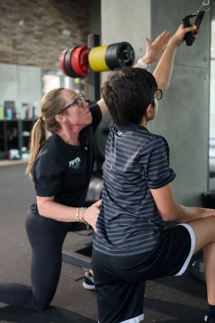 Tripp coaching an athlete during a training session